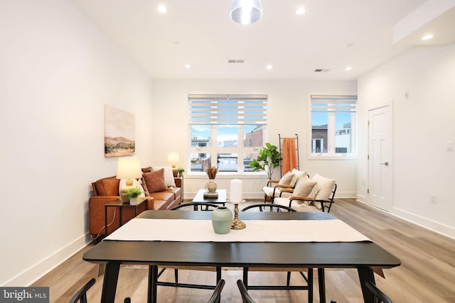 dining room with light hardwood / wood-style flooring