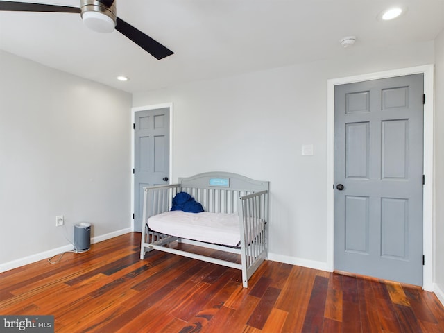 bedroom featuring dark wood-type flooring and ceiling fan