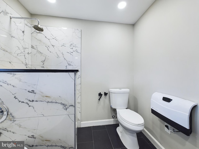 bathroom featuring walk in shower, tile patterned floors, and toilet