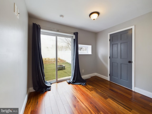 unfurnished room featuring hardwood / wood-style floors