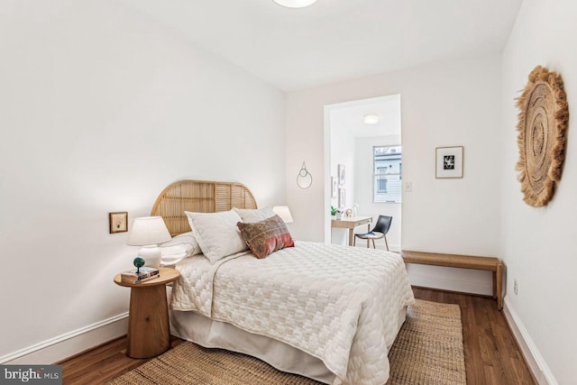 bedroom with hardwood / wood-style floors