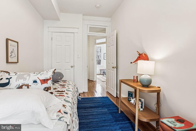 bedroom with hardwood / wood-style flooring