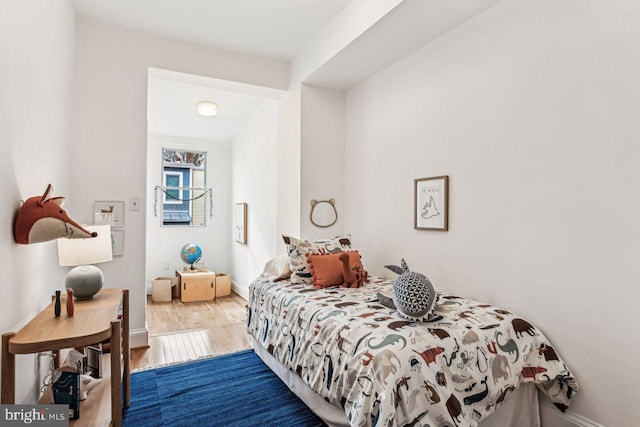 bedroom with hardwood / wood-style floors