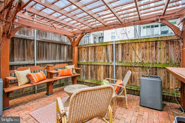 view of patio / terrace with an outdoor hangout area and a pergola