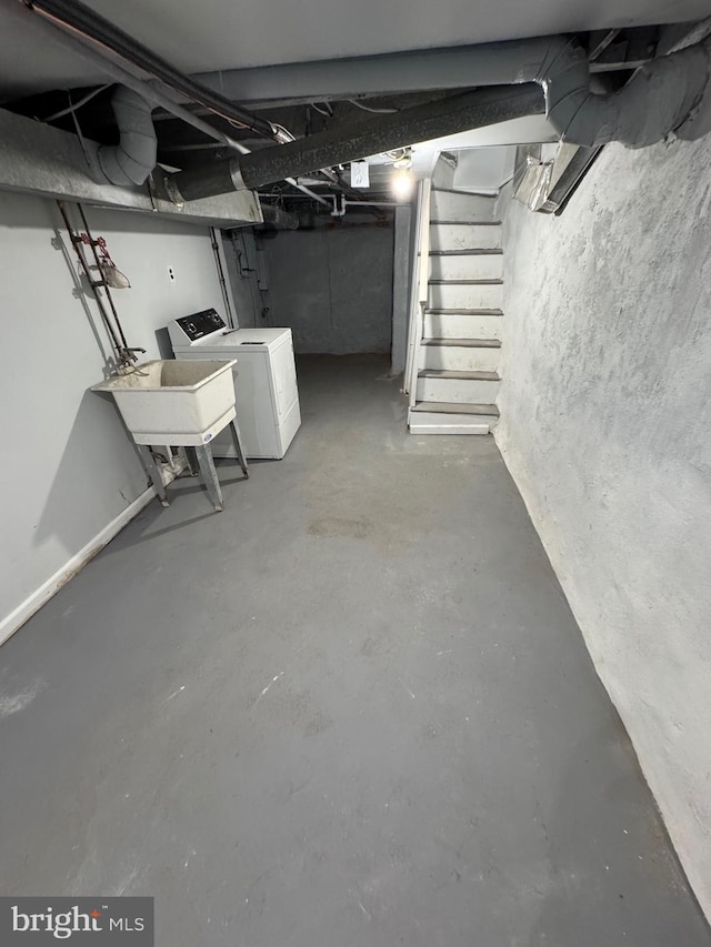 basement featuring washer / clothes dryer and sink