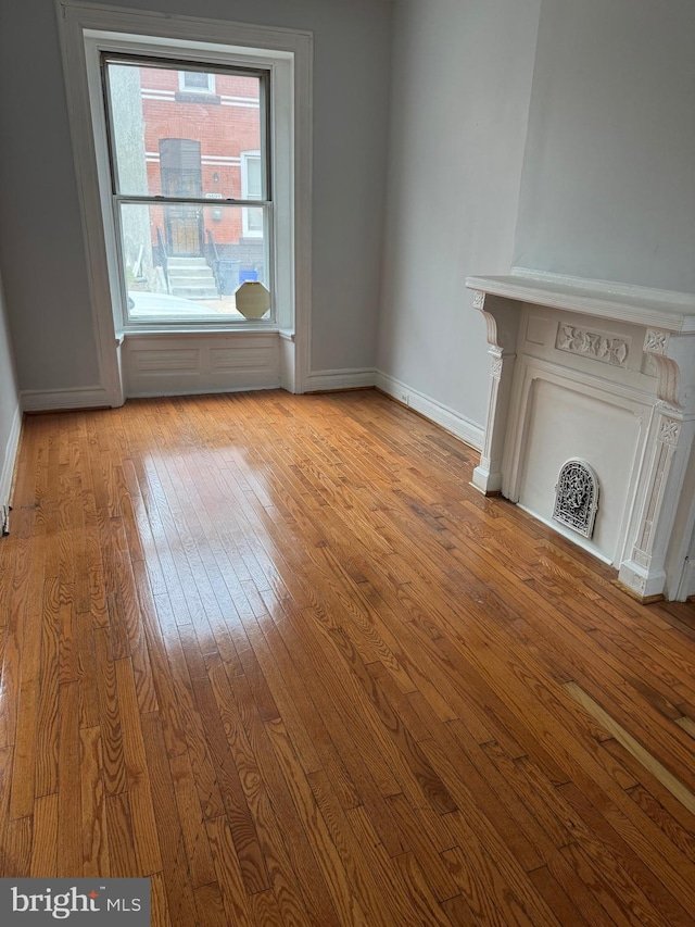 unfurnished living room with light wood-type flooring