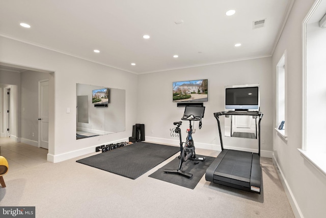 exercise area with baseboards, ornamental molding, visible vents, and recessed lighting