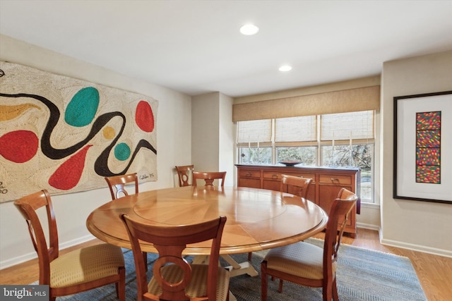 dining space with recessed lighting, baseboards, and light wood-style flooring