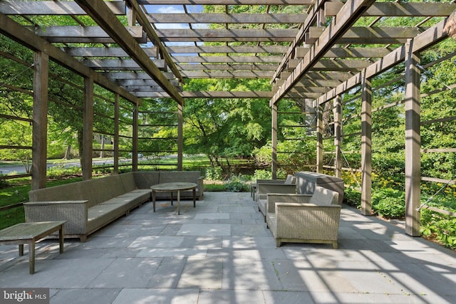view of patio with a pergola and an outdoor living space