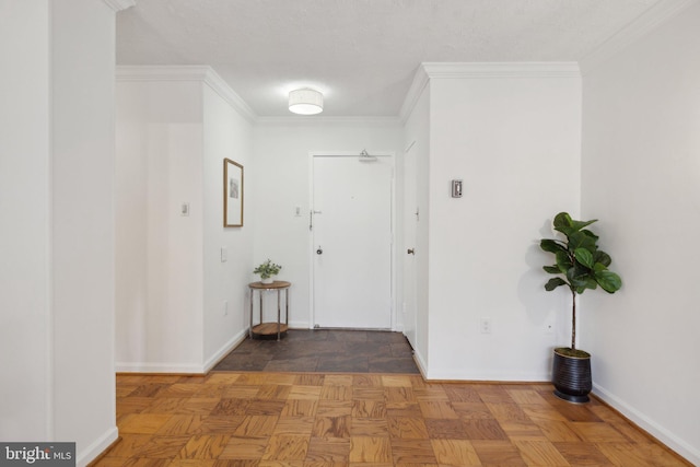 corridor with baseboards and crown molding