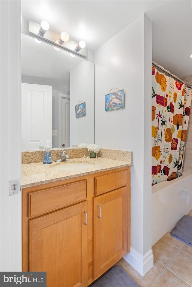 bathroom featuring tile patterned flooring and vanity