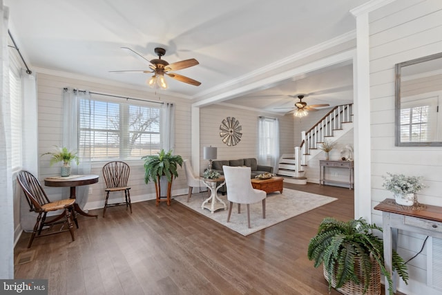 sitting room with ornamental molding, a healthy amount of sunlight, ceiling fan, and wood finished floors