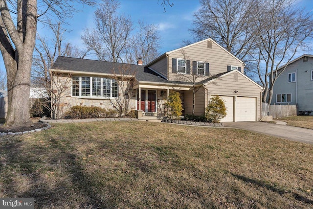 view of front of home featuring an attached garage, fence, concrete driveway, a chimney, and a front yard