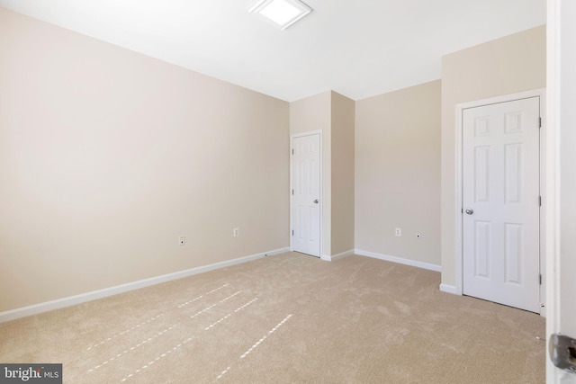 unfurnished bedroom with light carpet