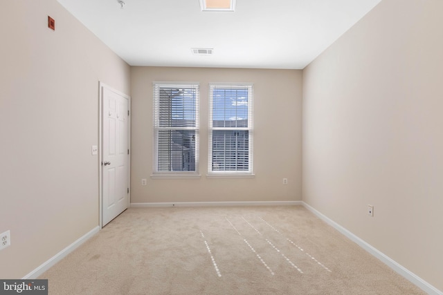 empty room featuring light colored carpet