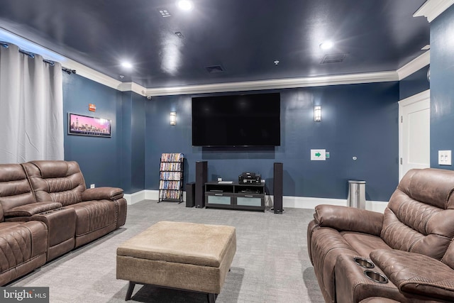 carpeted cinema room with crown molding