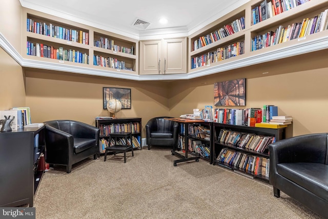 sitting room featuring light colored carpet