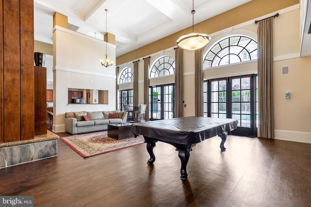 rec room featuring french doors, coffered ceiling, wood-type flooring, beam ceiling, and a high ceiling