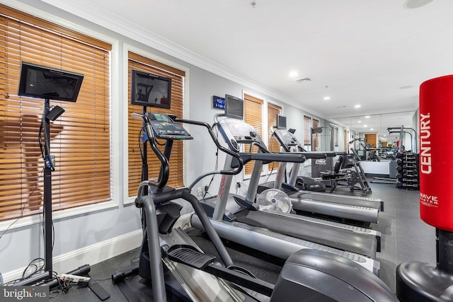 gym featuring crown molding