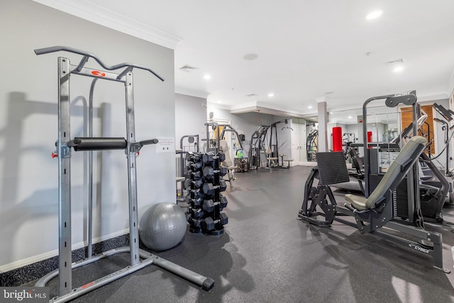 workout area featuring crown molding