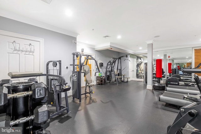 gym featuring crown molding