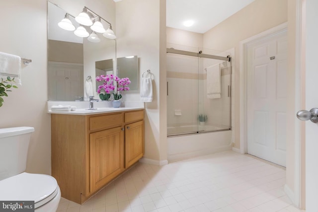 full bathroom with vanity, shower / bath combination with glass door, and toilet