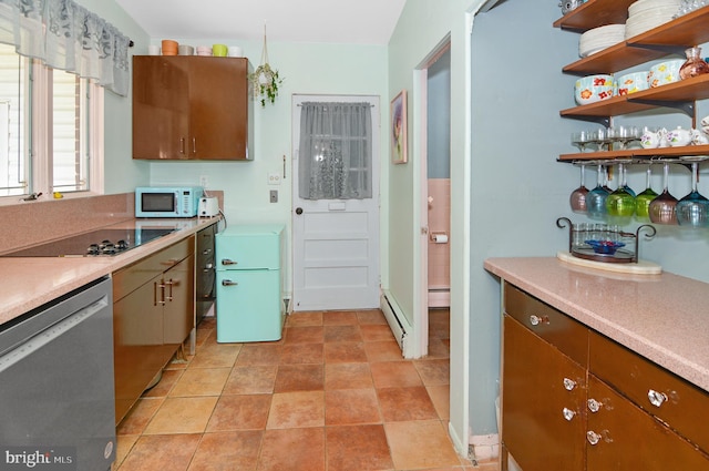 kitchen with white microwave, black electric cooktop, light countertops, fridge, and stainless steel dishwasher