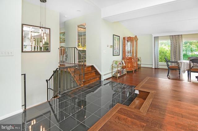 interior space featuring lofted ceiling, stairs, baseboards, and dark wood finished floors