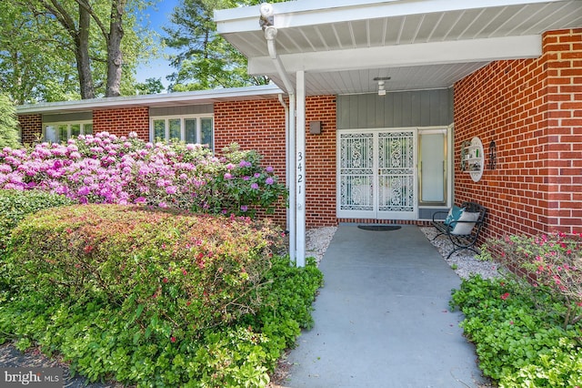 entrance to property with brick siding