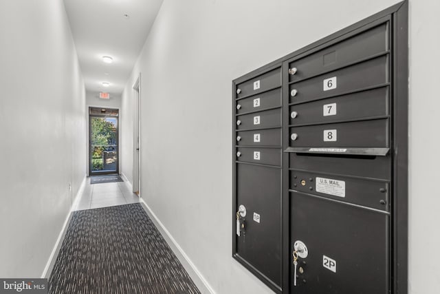 corridor with mail boxes and light colored carpet