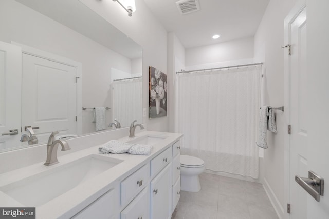 full bathroom featuring vanity, shower / tub combo with curtain, toilet, and tile patterned flooring