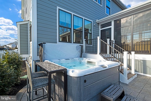 view of patio / terrace with a hot tub