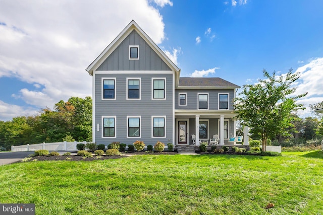 view of front of house featuring a front lawn and a porch