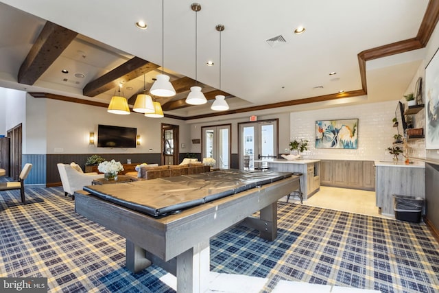 rec room featuring a wainscoted wall, pool table, visible vents, beam ceiling, and a raised ceiling