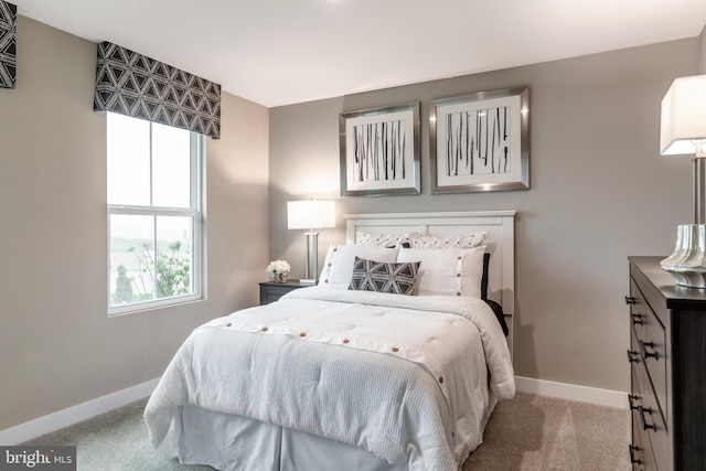 bedroom featuring light colored carpet