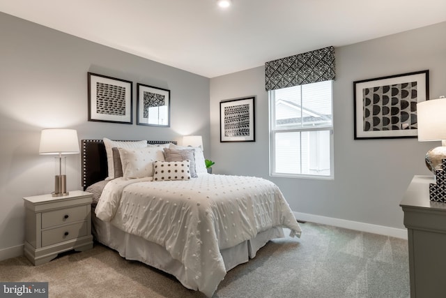 bedroom with light colored carpet