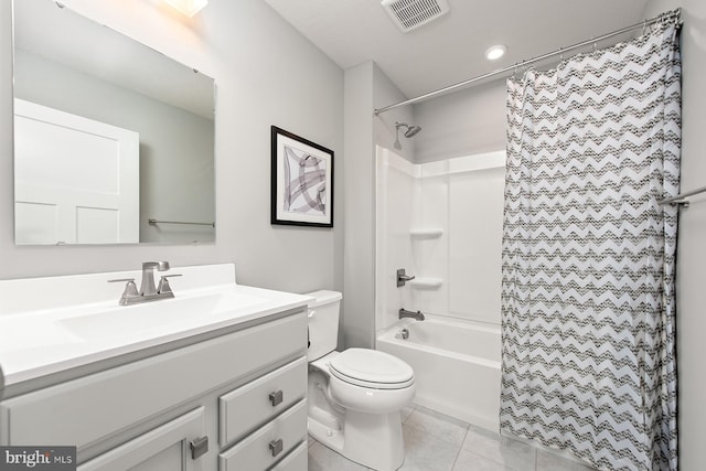 full bathroom featuring tile patterned flooring, vanity, shower / bath combo with shower curtain, and toilet