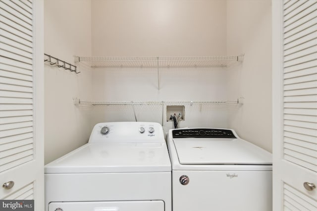 washroom with washer and clothes dryer