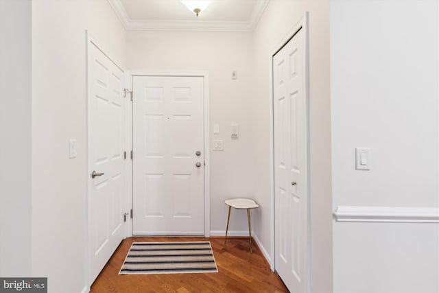 entryway featuring hardwood / wood-style flooring and ornamental molding