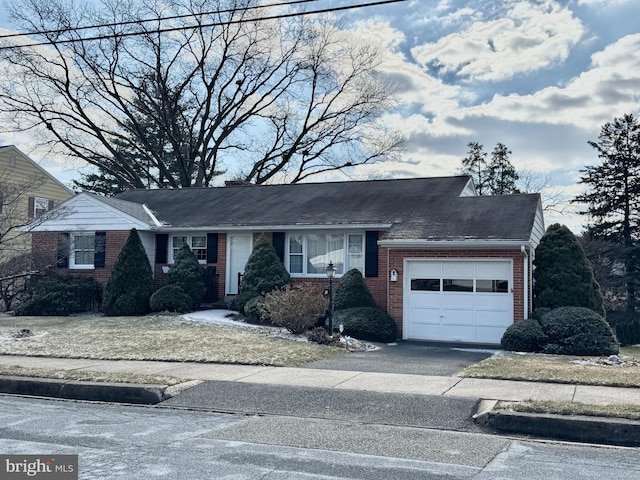 single story home with a garage