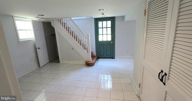 tiled entryway featuring plenty of natural light