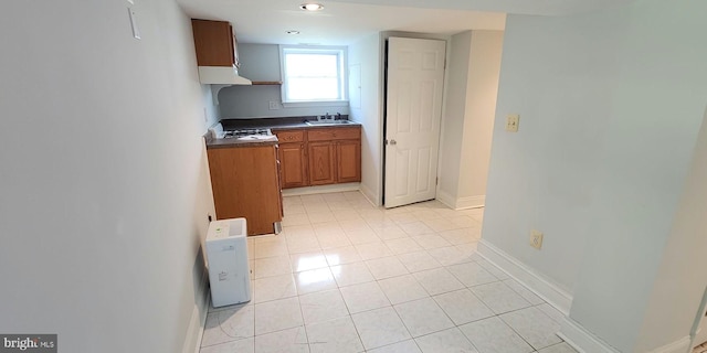 kitchen with sink and light tile patterned flooring