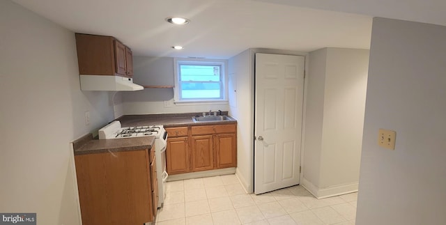 kitchen with white range with gas cooktop and sink