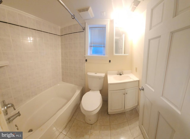 full bathroom with vanity, tile patterned flooring, tiled shower / bath combo, and toilet