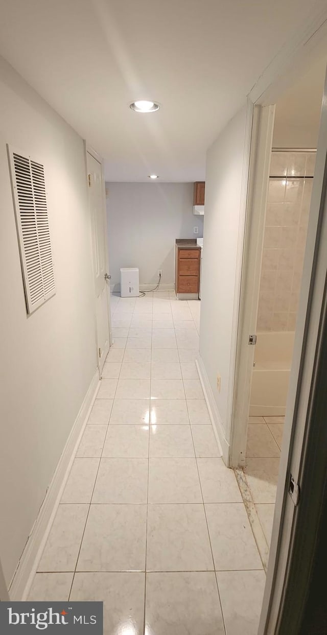 hallway featuring light tile patterned flooring