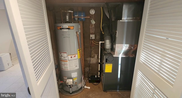 utility room featuring gas water heater