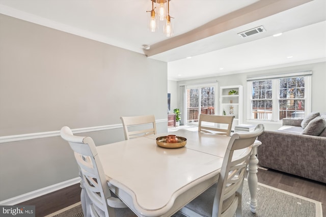 dining space with baseboards, visible vents, wood finished floors, and recessed lighting