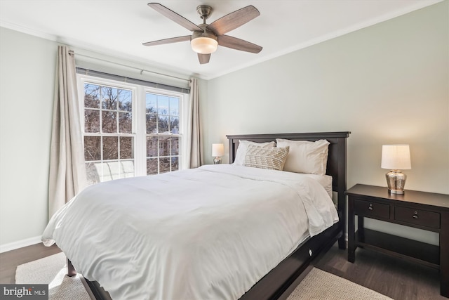 bedroom featuring baseboards, ceiling fan, dark wood finished floors, and crown molding