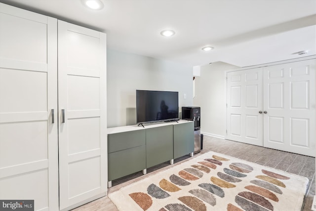 interior space with light wood-style floors and recessed lighting