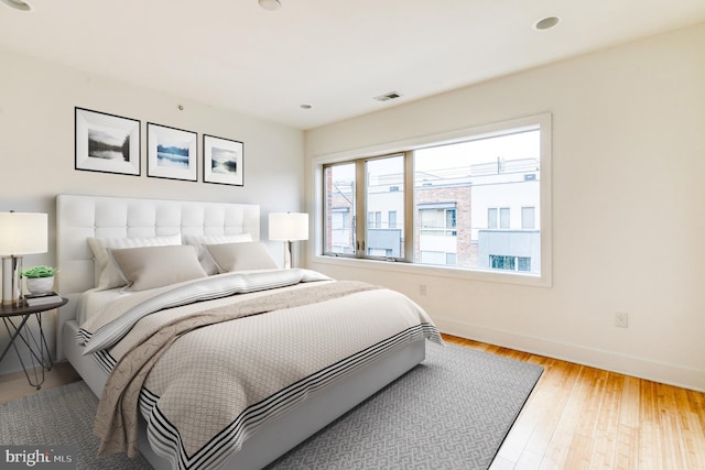 bedroom with light hardwood / wood-style floors